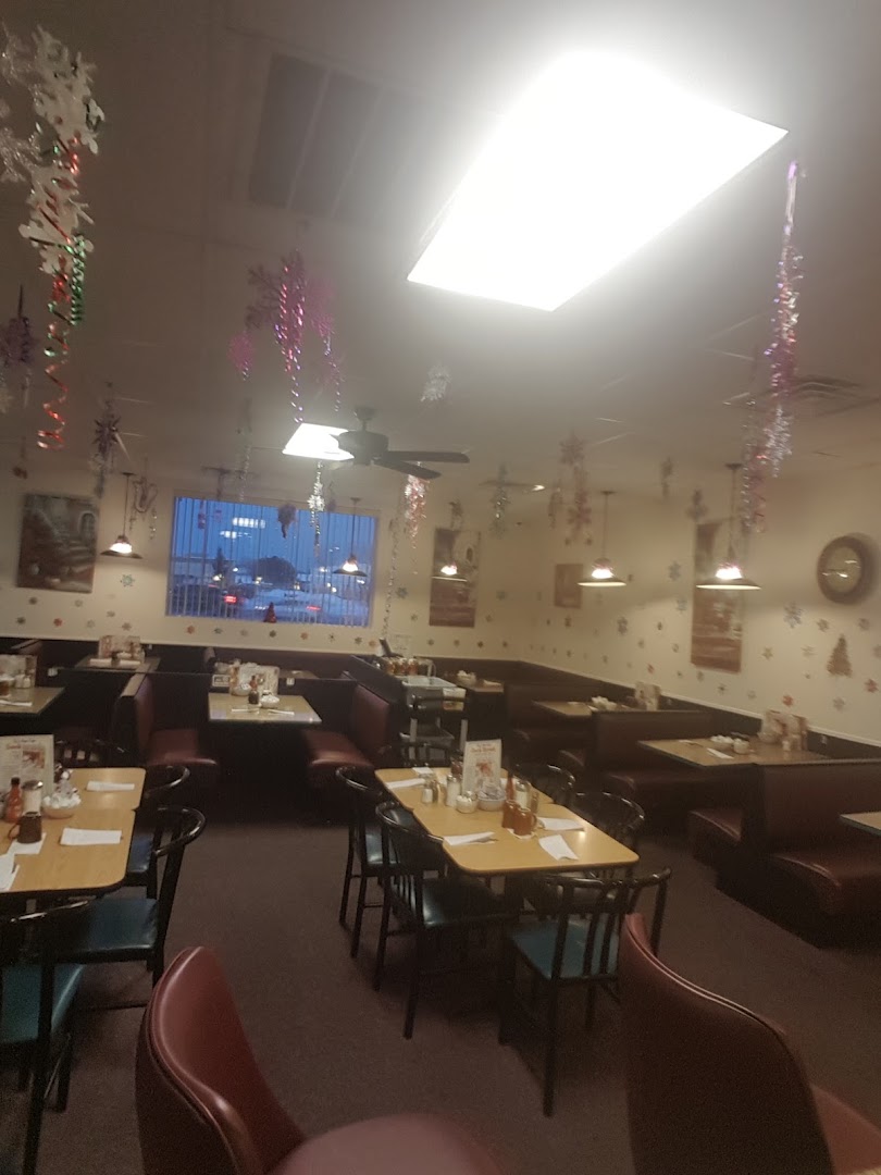 The Liz's Ham Cafe dining room, with booths, table settings and hanging decorations